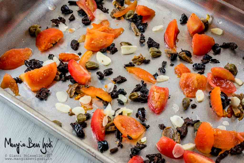 Preparazione orate al forno con pomodorini