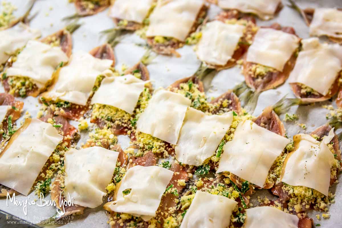 Preparazione sarde al forno con lardo