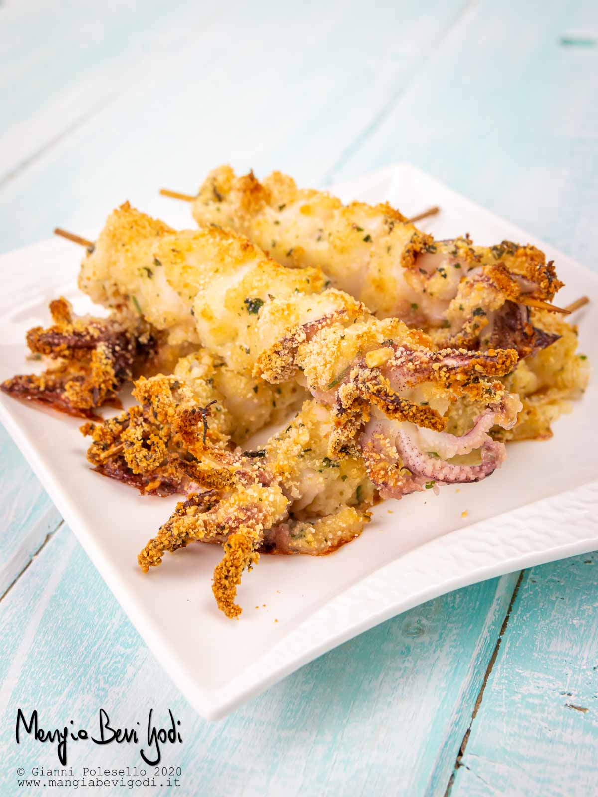 Spiedini di calamari al forno gratinati